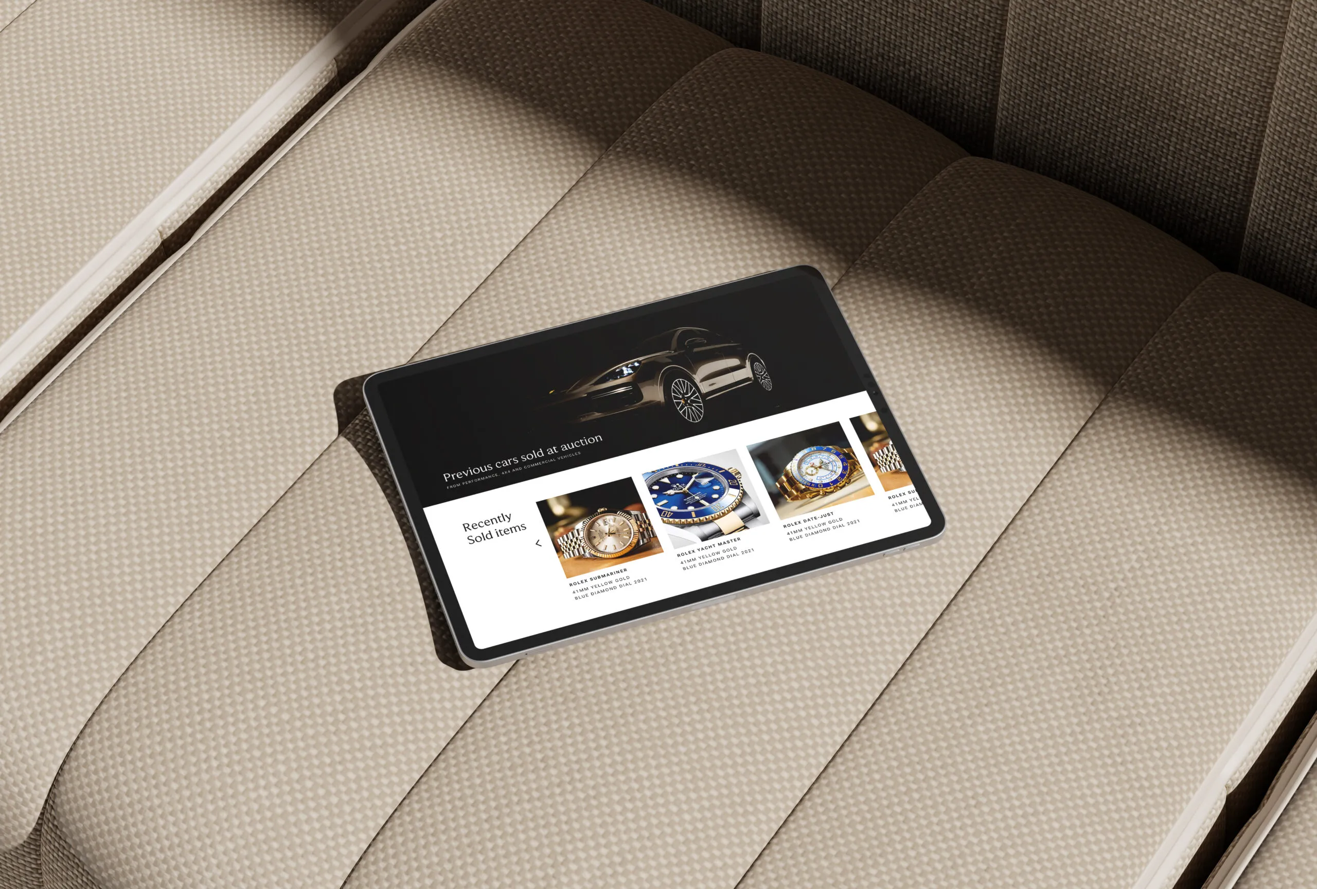 tablet showcasing a luxury auctions website