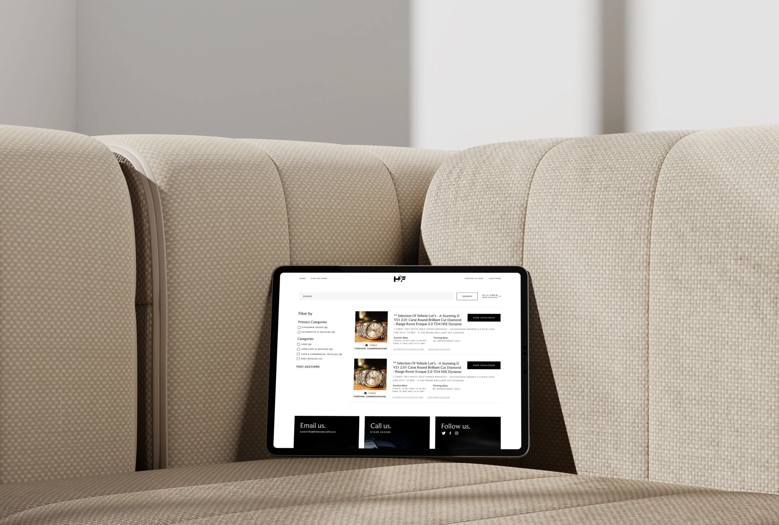 tablet showing a screenshot of some auction listings